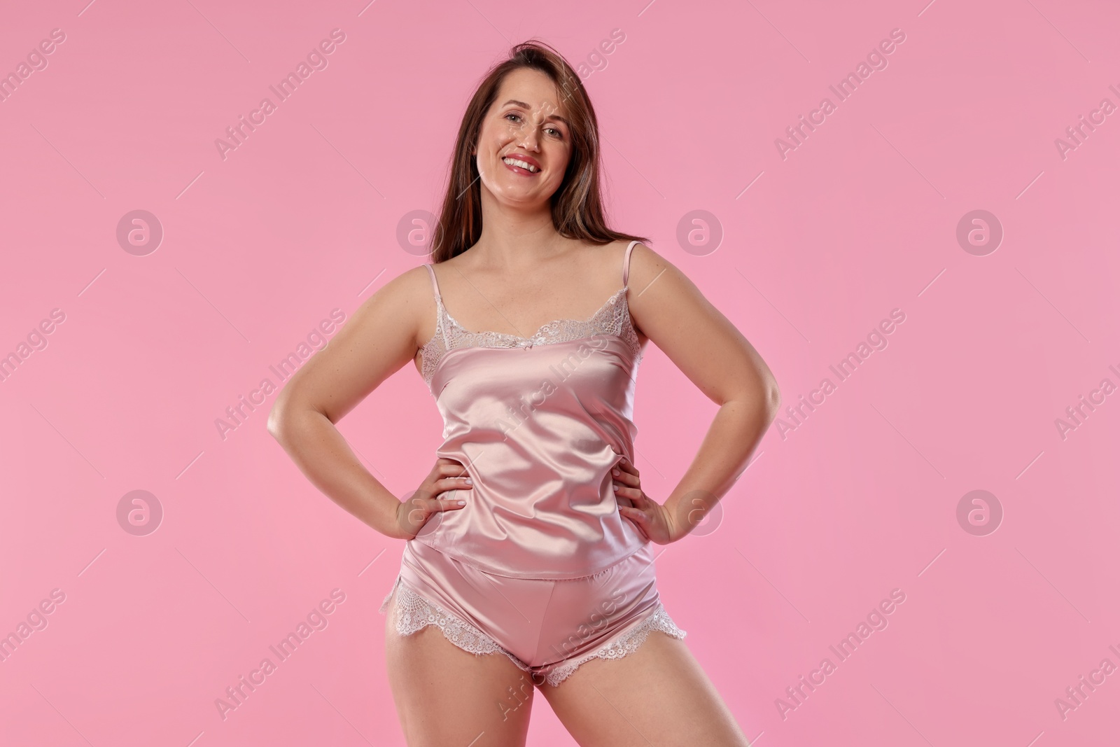 Photo of Woman in underwear on pink background. Cellulite problem