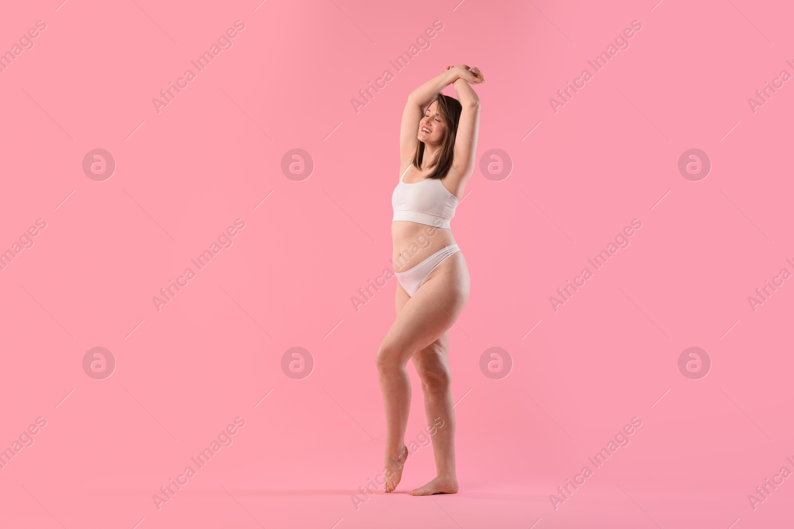 Photo of Woman in underwear on pink background, space for text. Cellulite problem