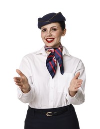 Smiling flight attendant demonstrating safety instruction on white background