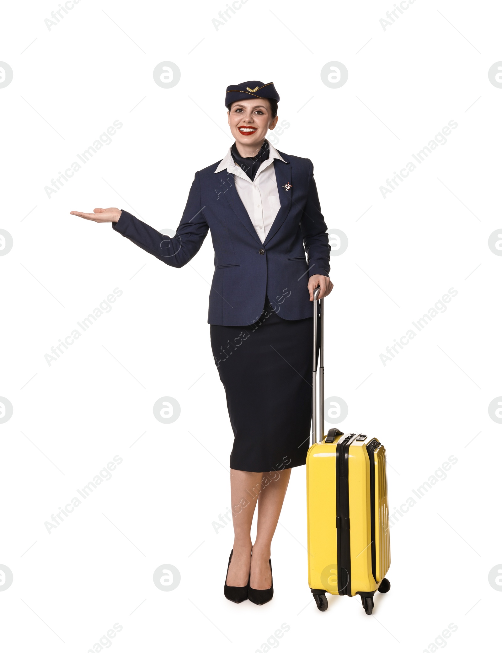 Photo of Smiling stewardess with suitcase showing something on white background