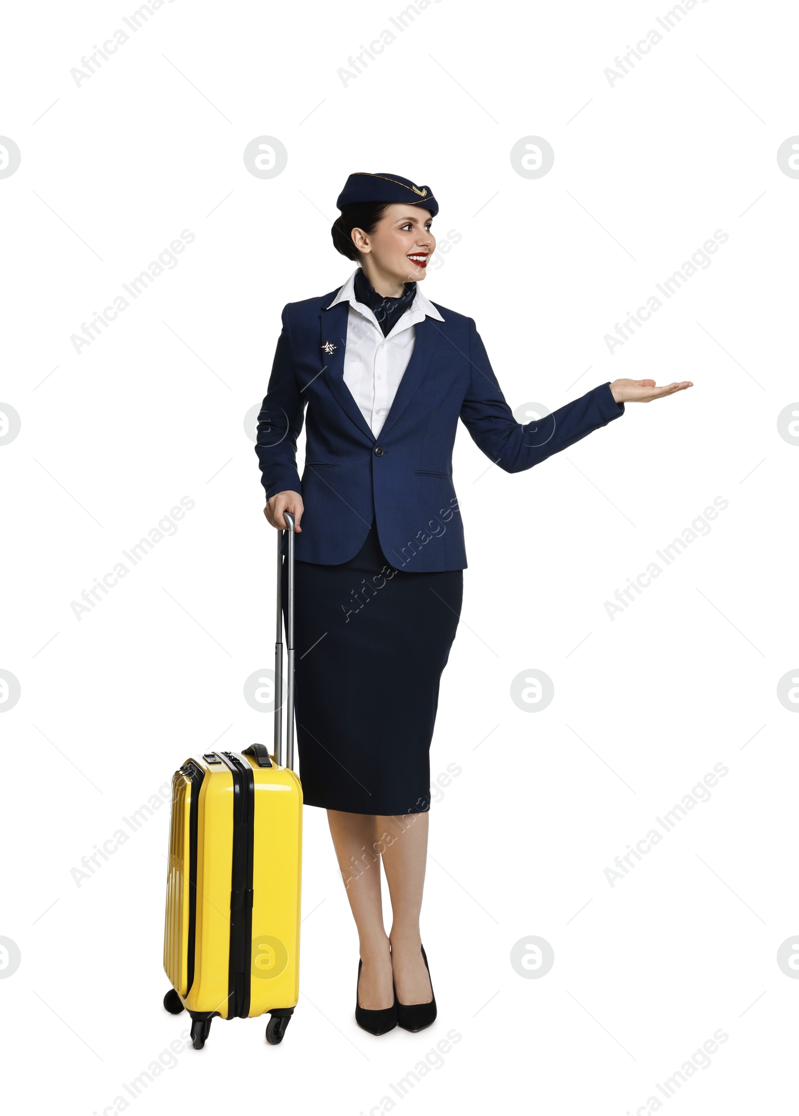 Photo of Smiling stewardess with suitcase showing something on white background