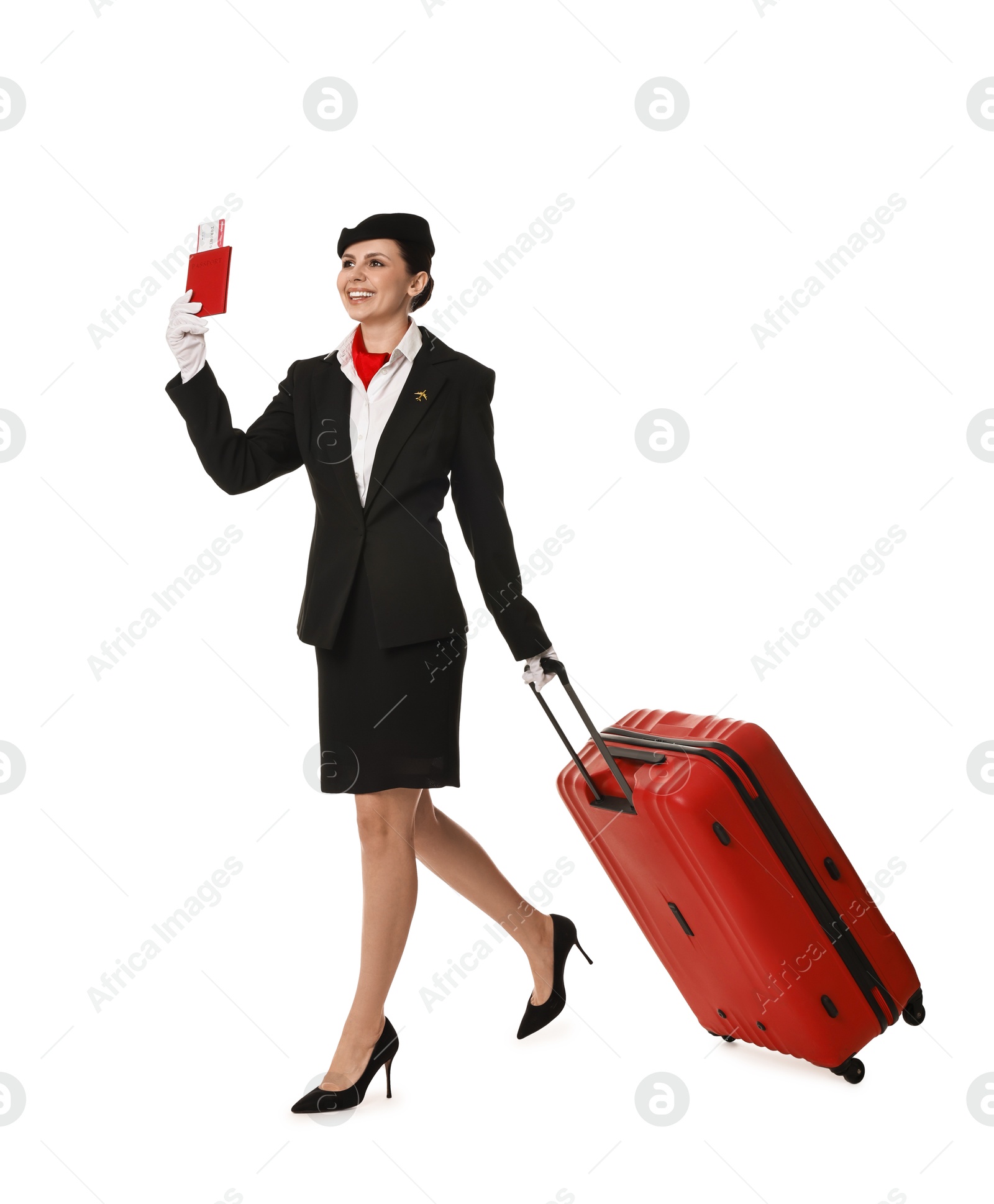 Photo of Smiling stewardess with suitcase, passport and flight ticket on white background