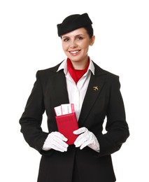 Happy stewardess holding passport with flight tickets on white background