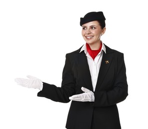 Photo of Smiling flight attendant showing something on white background