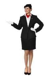 Photo of Smiling flight attendant showing something on white background