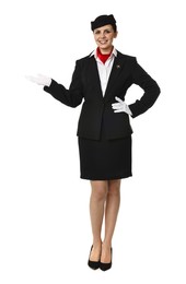 Smiling flight attendant showing something on white background