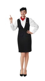 Smiling flight attendant pointing at something on white background