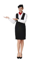 Photo of Smiling flight attendant showing something on white background