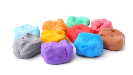 Photo of Different colorful play dough isolated on white