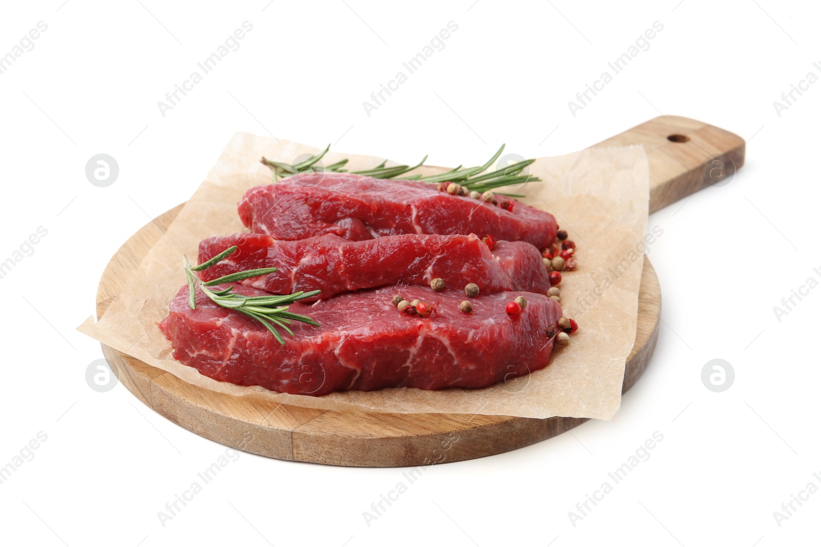 Photo of Pieces of raw beef meat, rosemary and peppercorns isolated on white