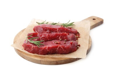 Photo of Pieces of raw beef meat, rosemary and peppercorns isolated on white