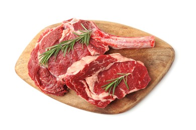 Photo of Pieces of raw beef meat and rosemary isolated on white, top view