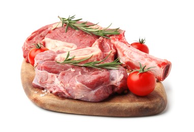 Photo of Pieces of raw beef meat, spices and tomatoes isolated on white