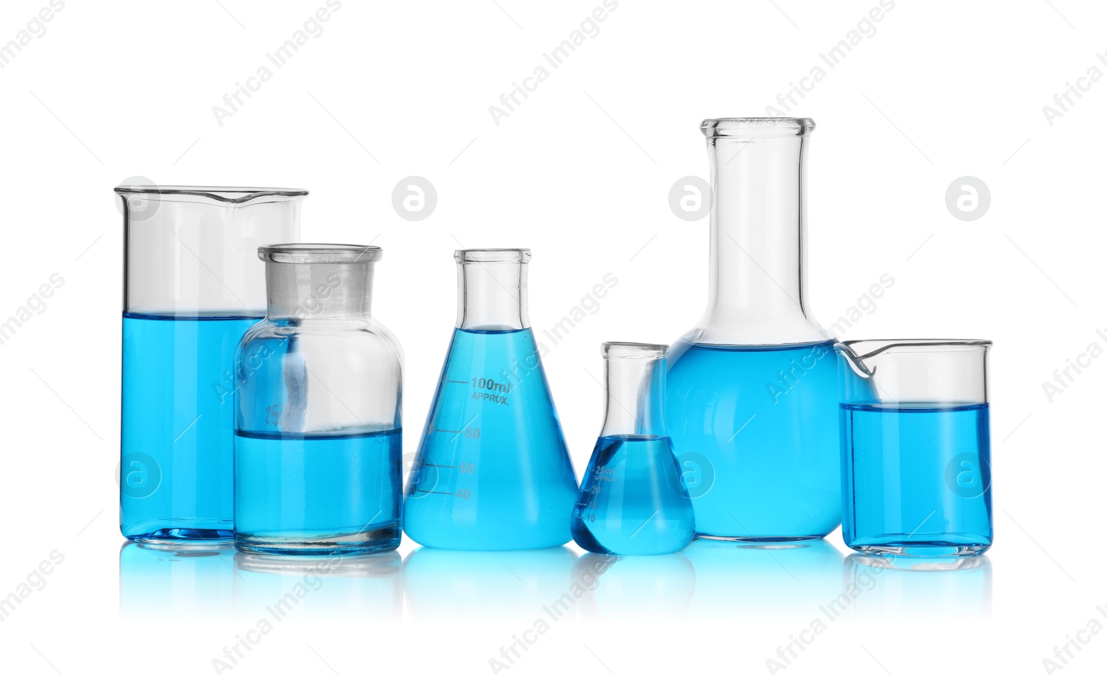 Photo of Laboratory glassware with blue liquid isolated on white