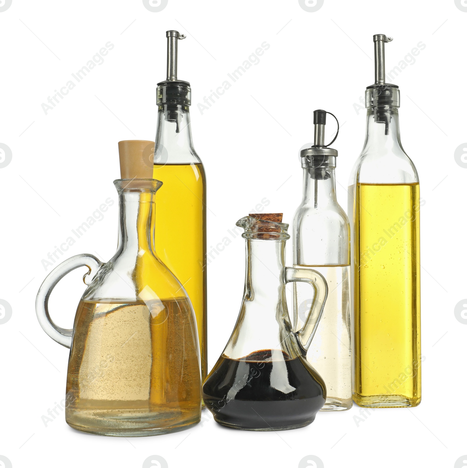 Photo of Oil and vinegar in bottles isolated on white