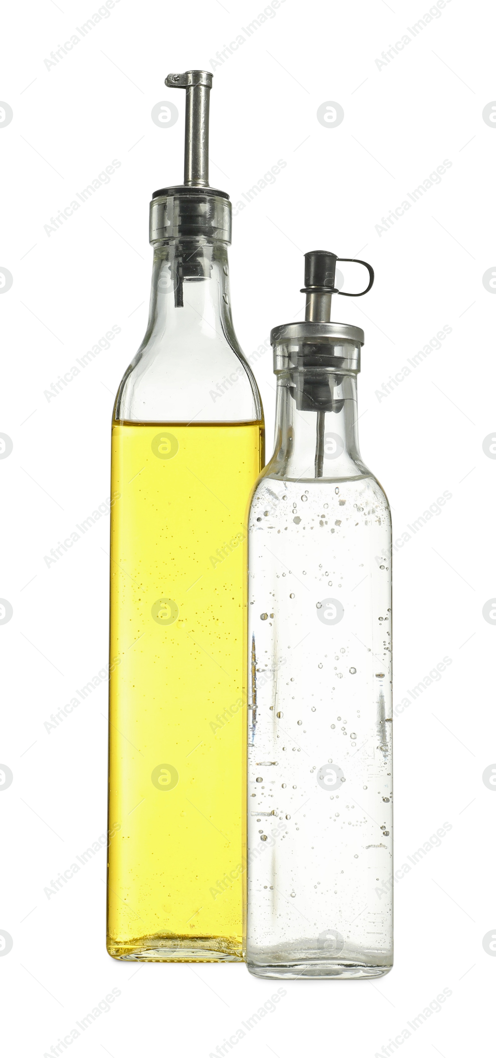 Photo of Oil and vinegar in bottles isolated on white