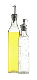 Photo of Oil and vinegar in bottles isolated on white