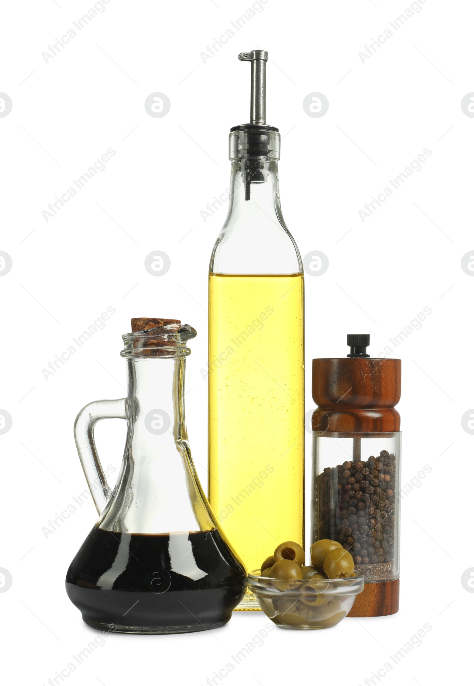 Photo of Salad dressings, pepper and olives isolated on white