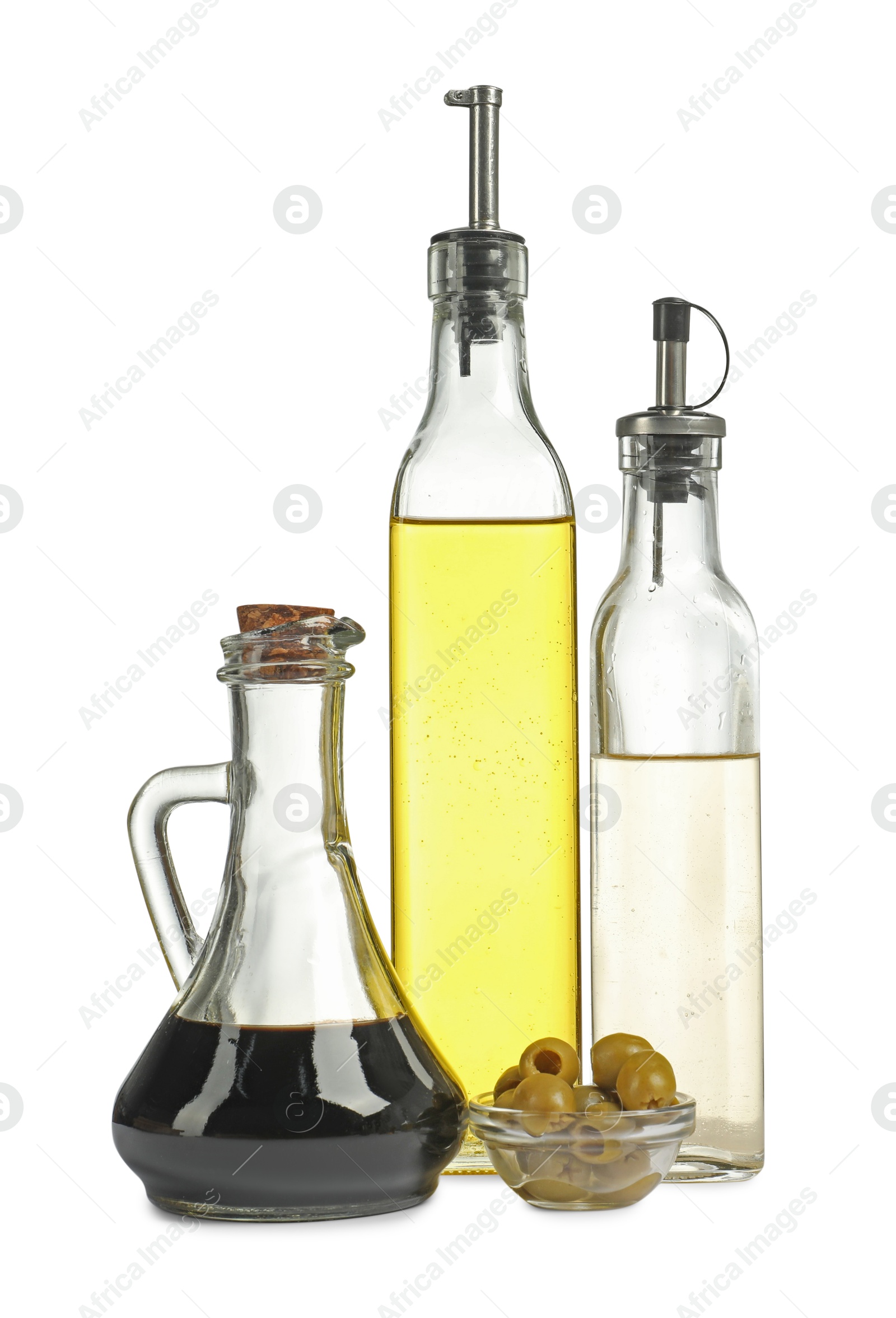 Photo of Salad dressings and olives isolated on white