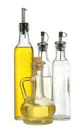 Photo of Oil and vinegar in bottles isolated on white