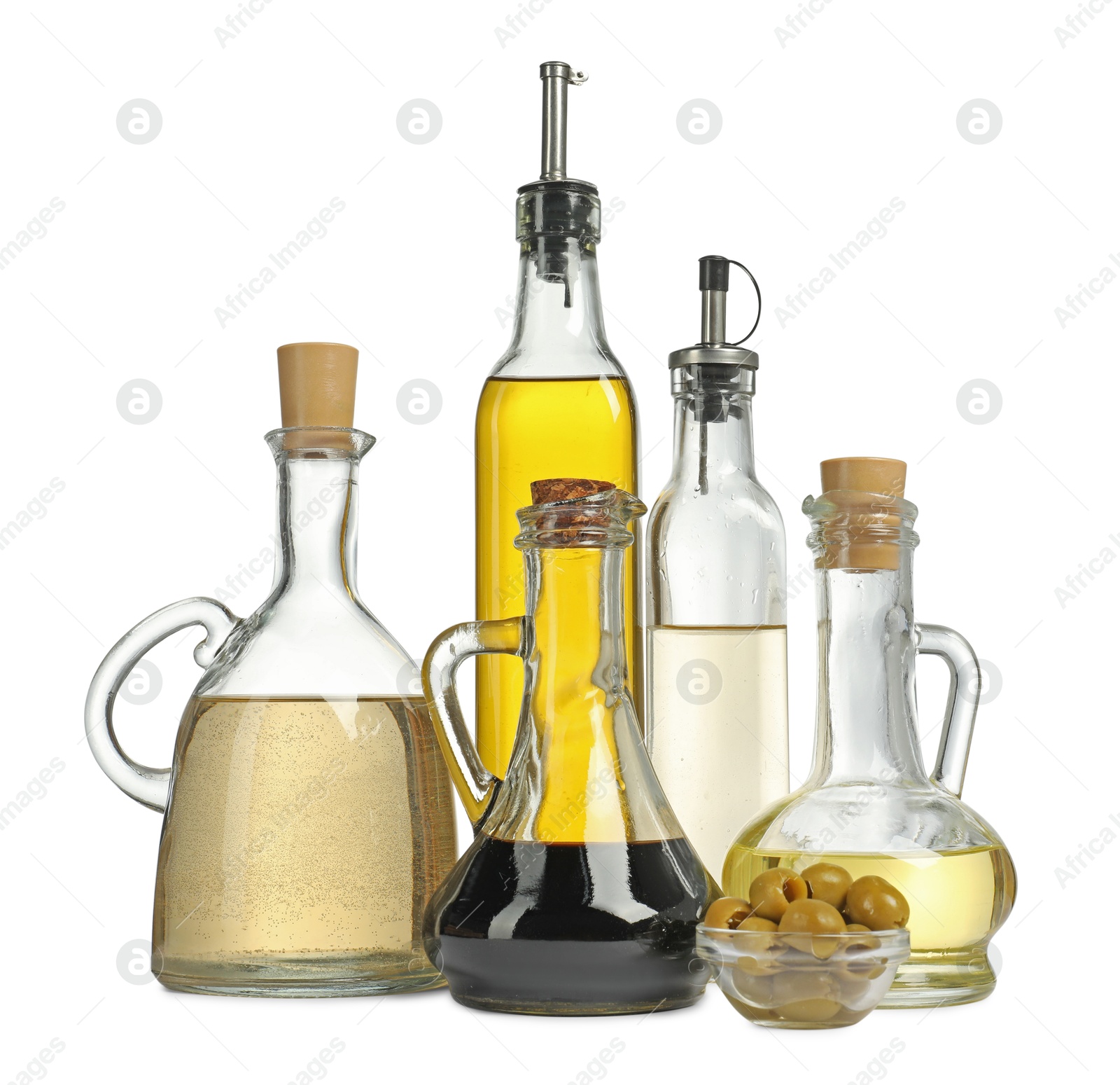 Photo of Salad dressings and olives isolated on white