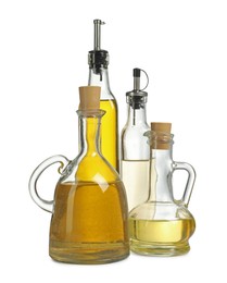 Photo of Oil and vinegar in bottles isolated on white