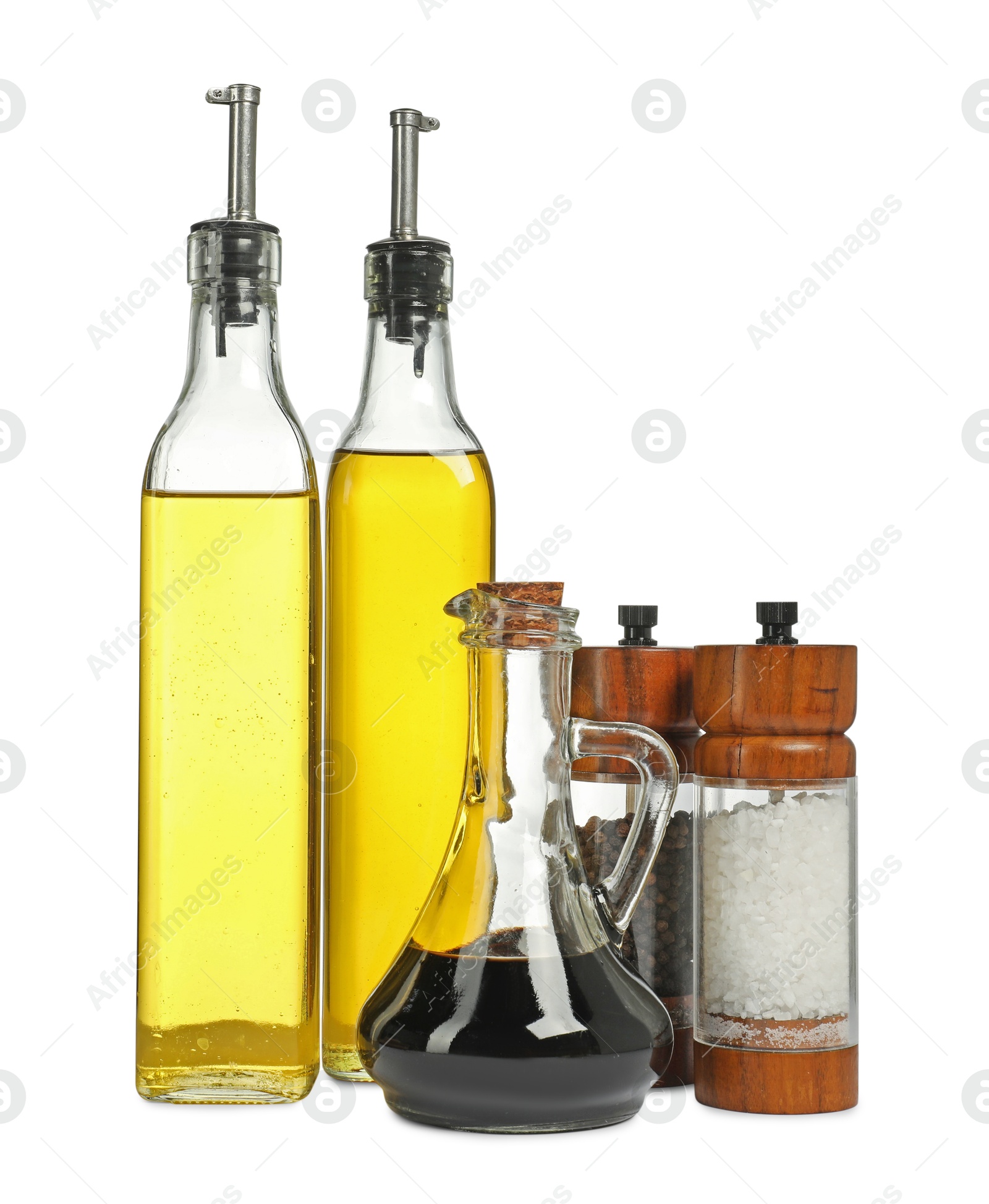 Photo of Salad dressings and spices isolated on white