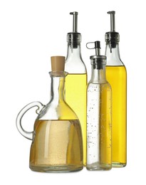 Photo of Oil and vinegar in bottles isolated on white