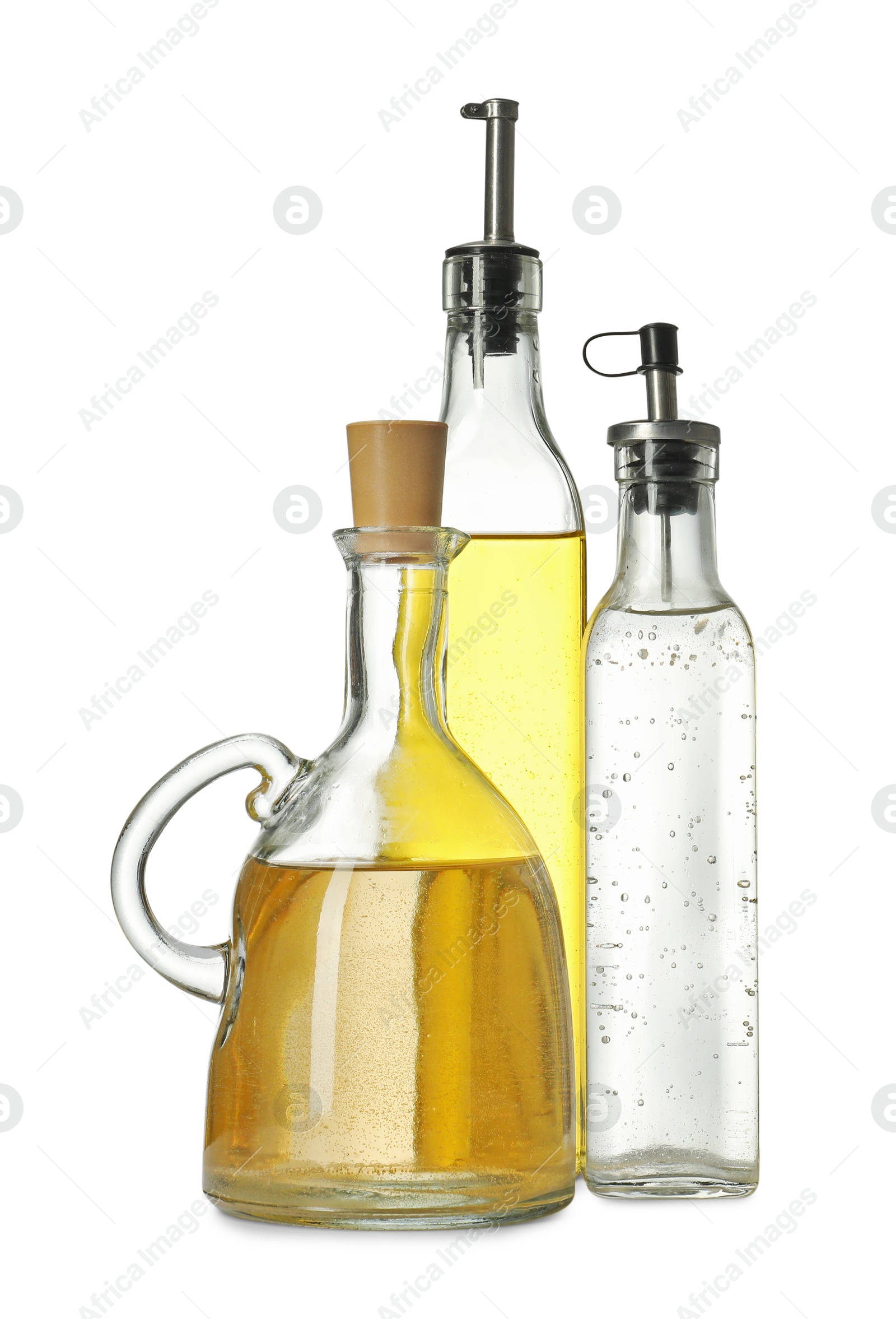 Photo of Oil and vinegar in bottles isolated on white