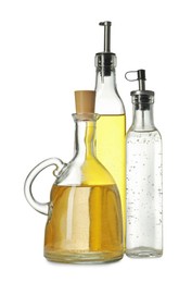 Photo of Oil and vinegar in bottles isolated on white