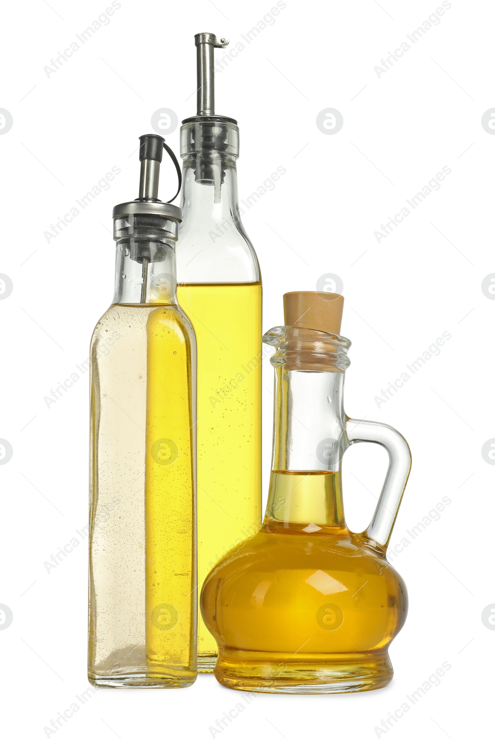 Photo of Oil and vinegar in bottles isolated on white