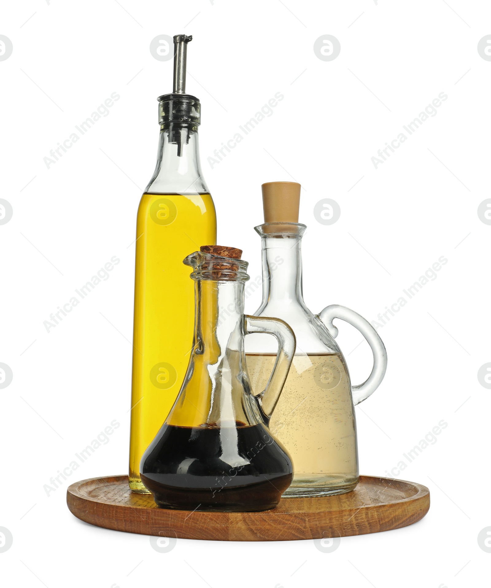 Photo of Oil and vinegar in bottles isolated on white