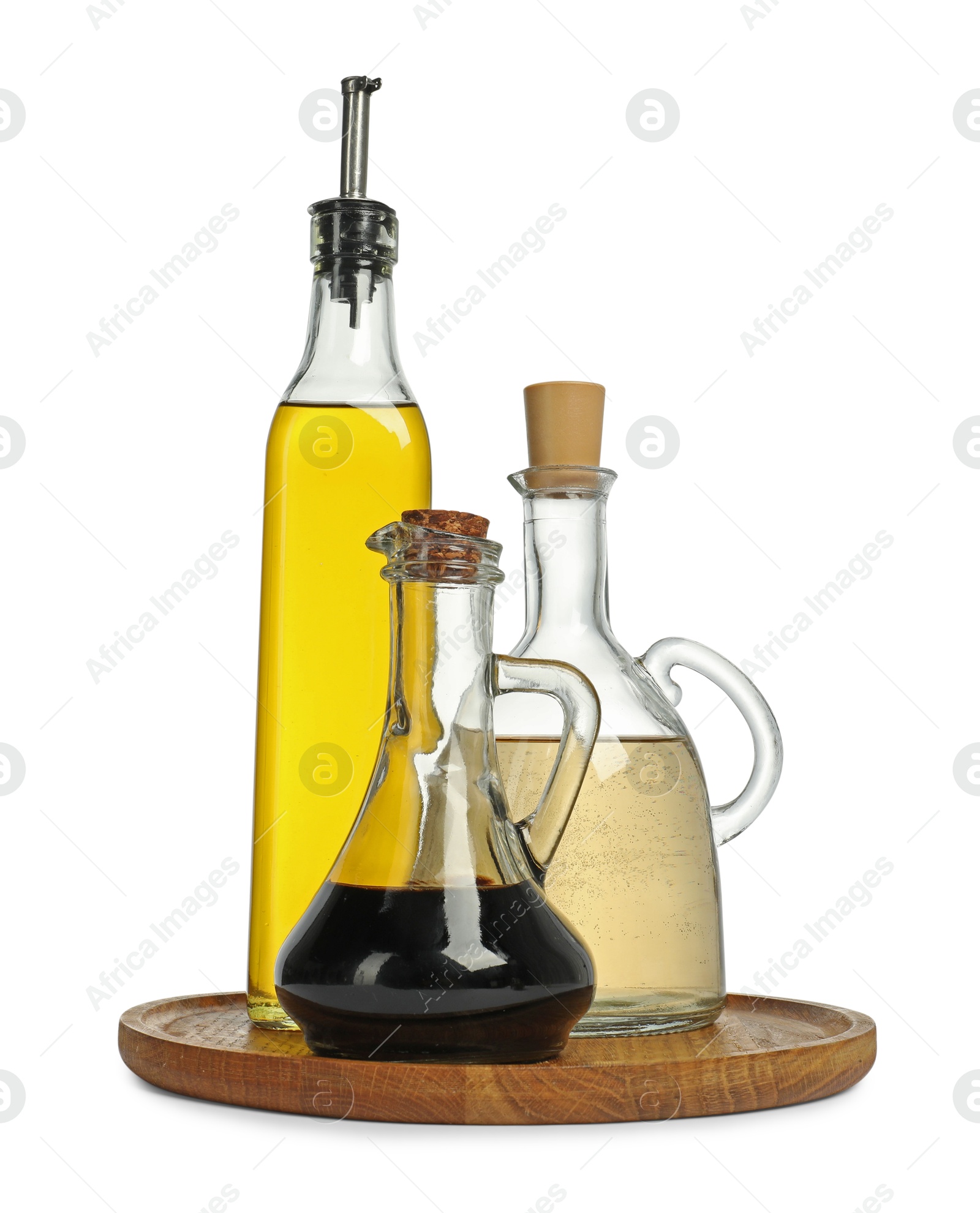 Photo of Oil and vinegar in bottles isolated on white