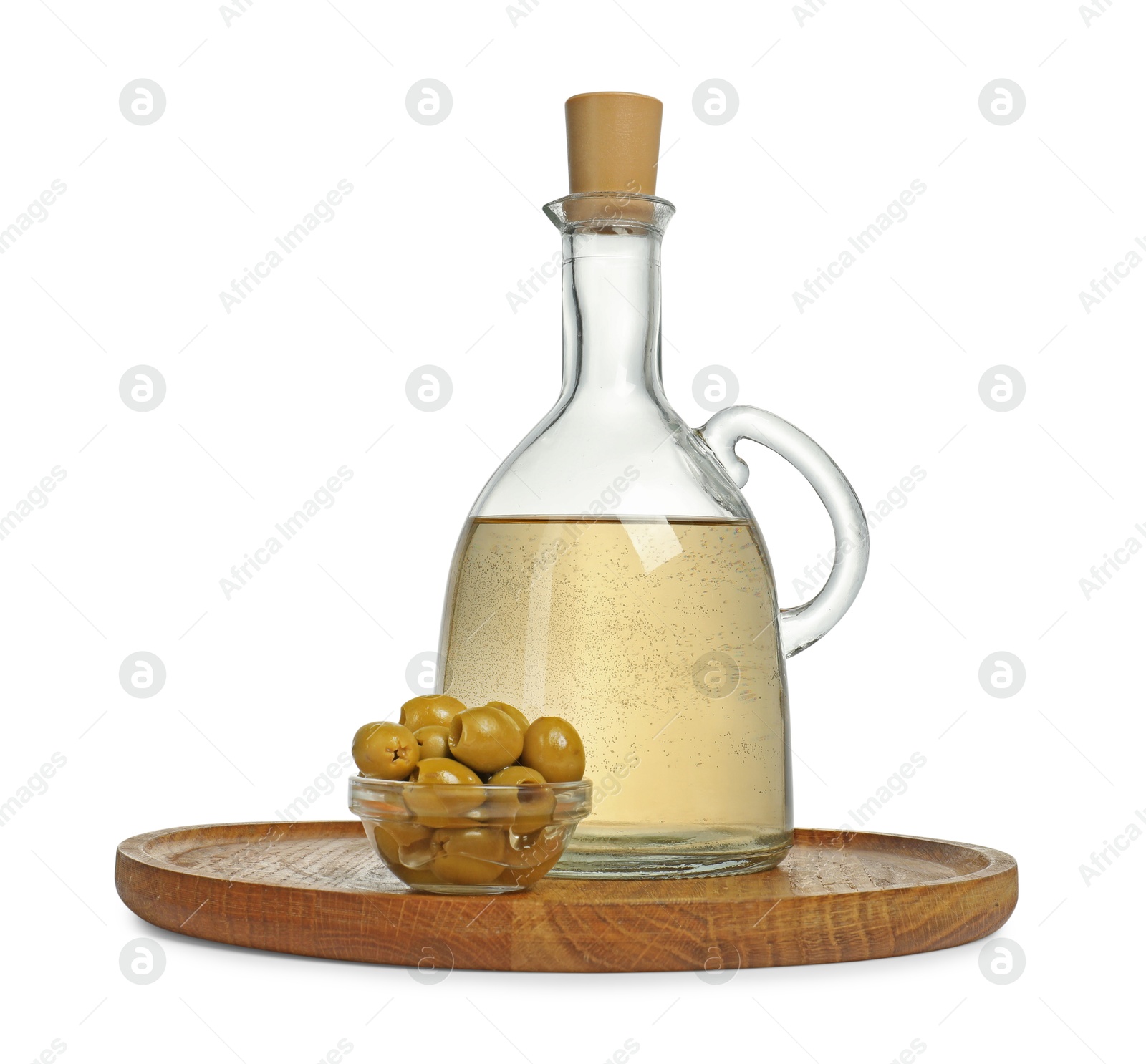 Photo of Vinegar and green olives isolated on white