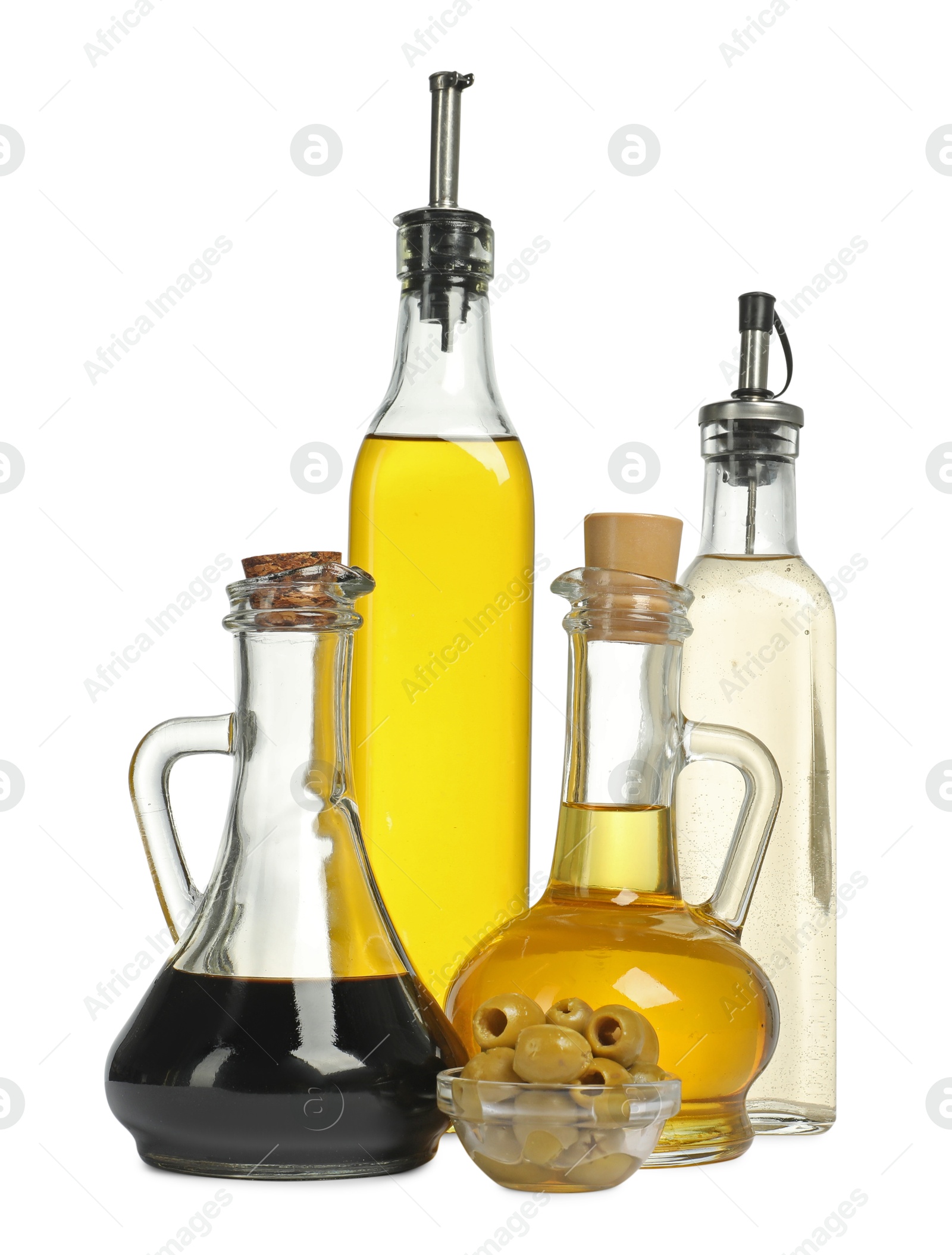 Photo of Salad dressings and olives isolated on white