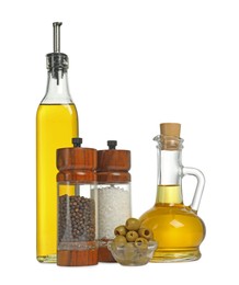 Photo of Salad dressings, spices and olives isolated on white