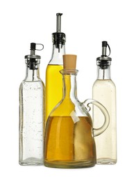 Photo of Oil and vinegar in bottles isolated on white