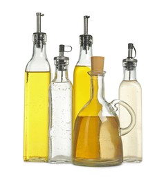 Photo of Oil and vinegar in bottles isolated on white