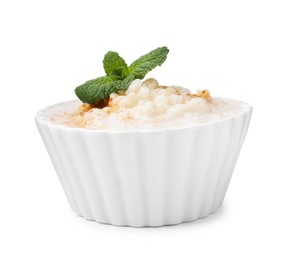 Photo of Tasty rice pudding with cinnamon and mint in bowl isolated on white