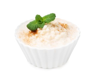 Photo of Tasty rice pudding with cinnamon and mint in bowl isolated on white