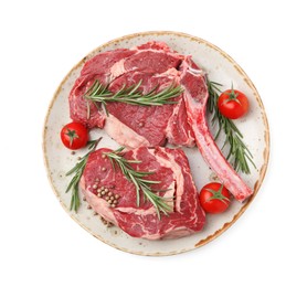 Photo of Pieces of raw beef meat, spices and tomatoes isolated on white, top view