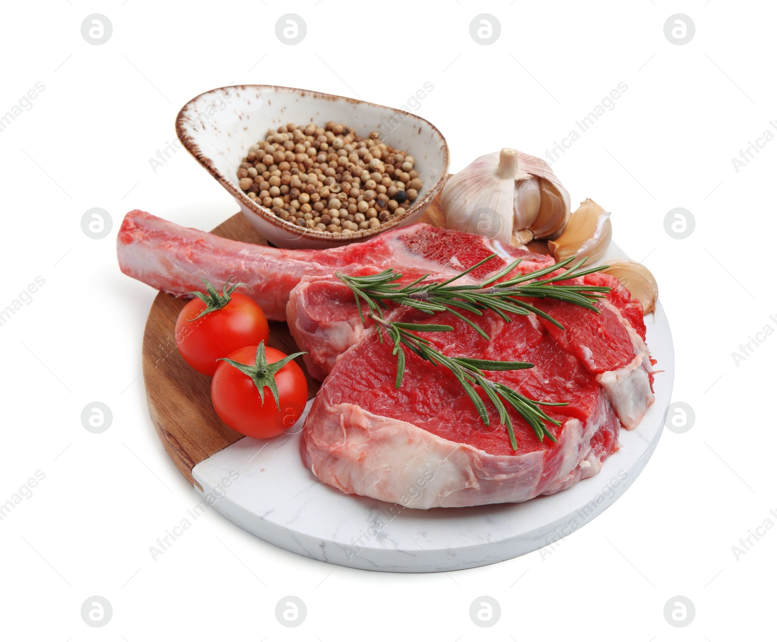 Photo of Piece of raw beef meat, spices and tomatoes isolated on white