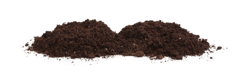 Photo of Piles of fresh soil isolated on white