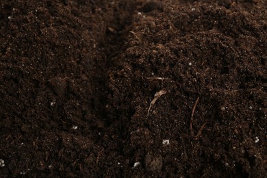 Photo of Texture of fresh soil as background, closeup