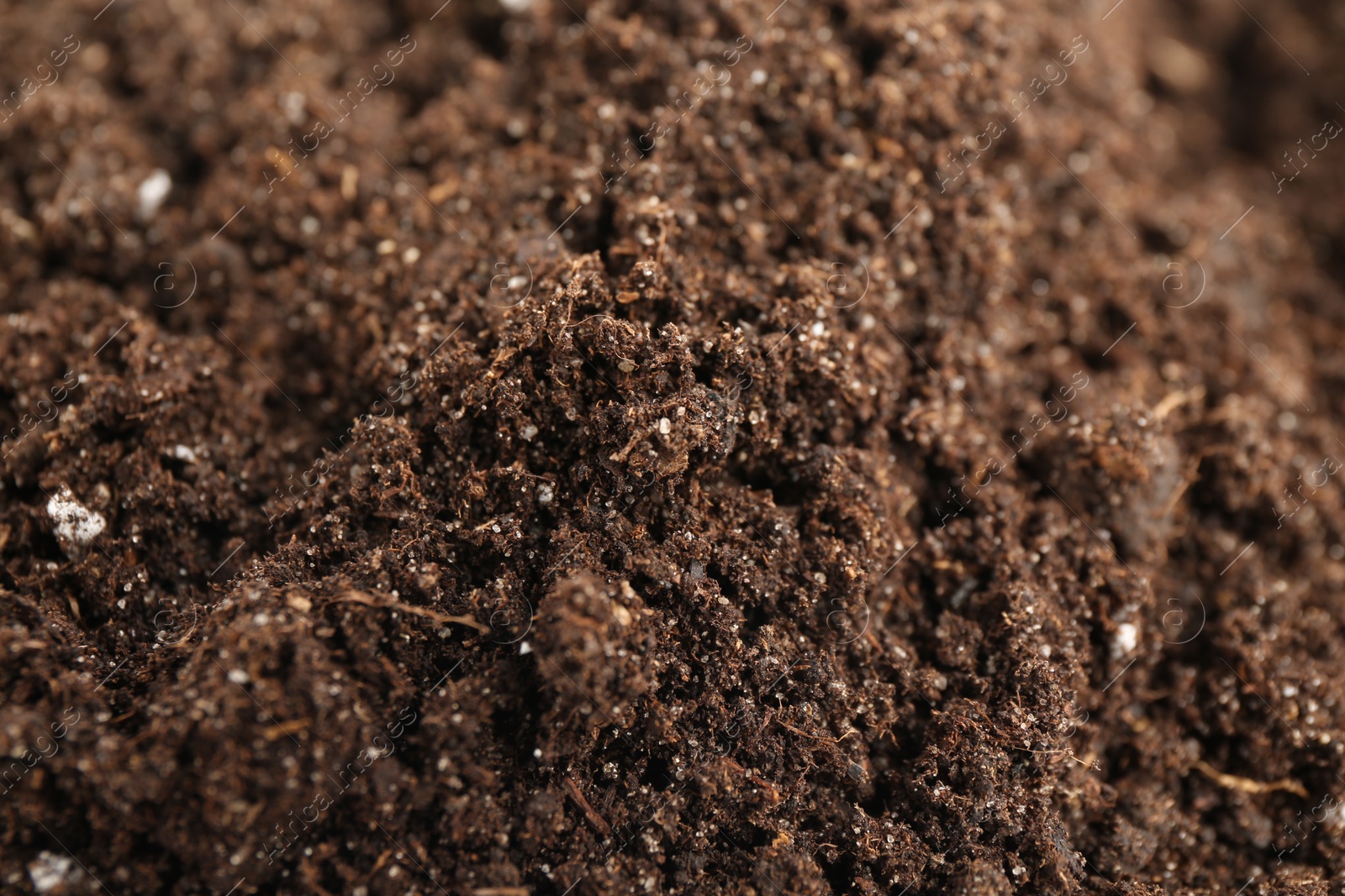 Photo of Texture of fresh soil as background, closeup