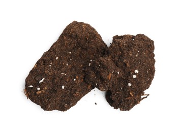 Photo of Piles of fresh soil isolated on white, top view