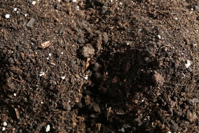 Photo of Texture of fresh soil as background, closeup