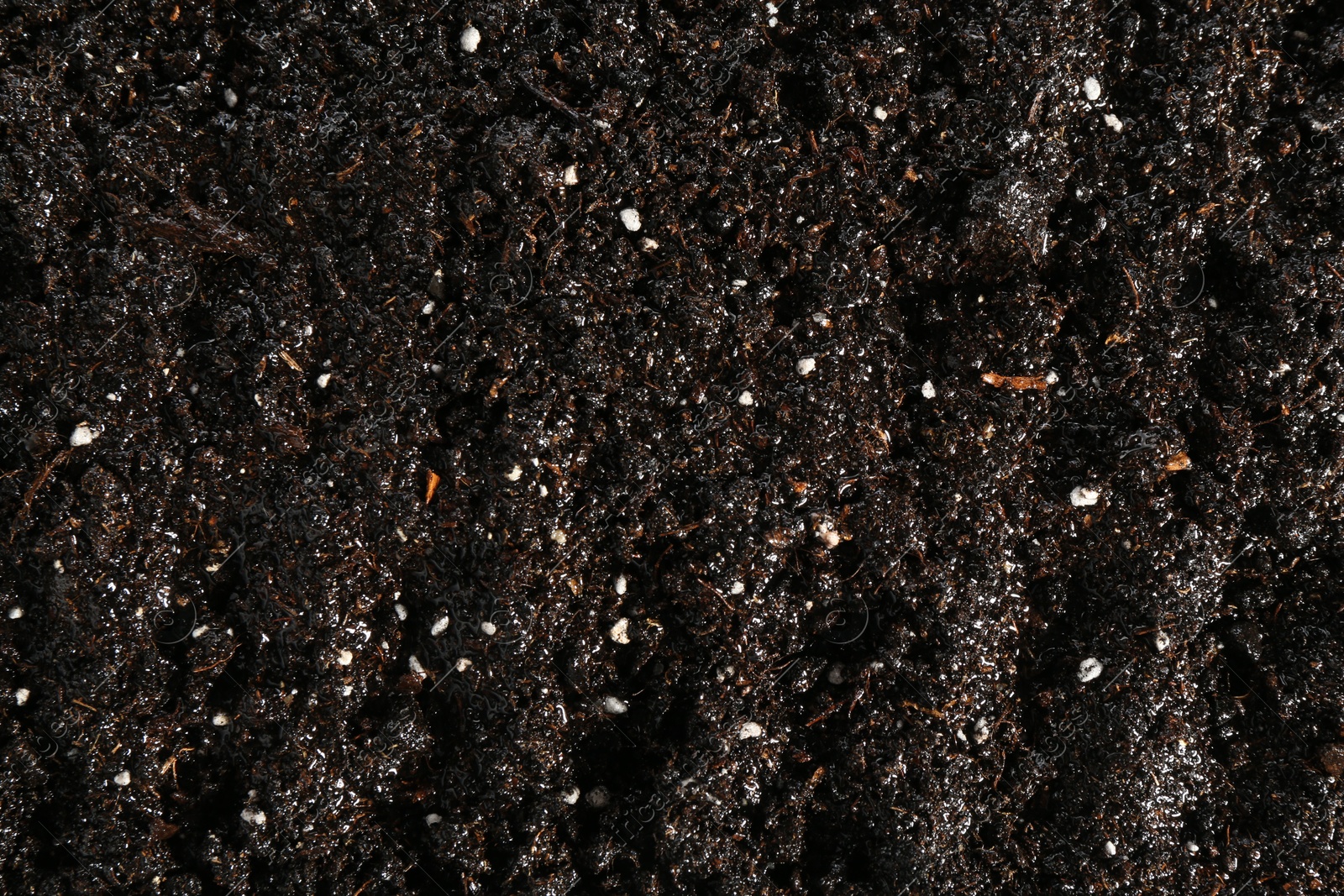 Photo of Texture of fresh soil as background, closeup