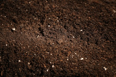 Photo of Texture of fresh soil as background, closeup