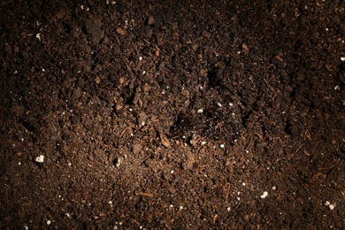 Photo of Texture of fresh soil as background, closeup